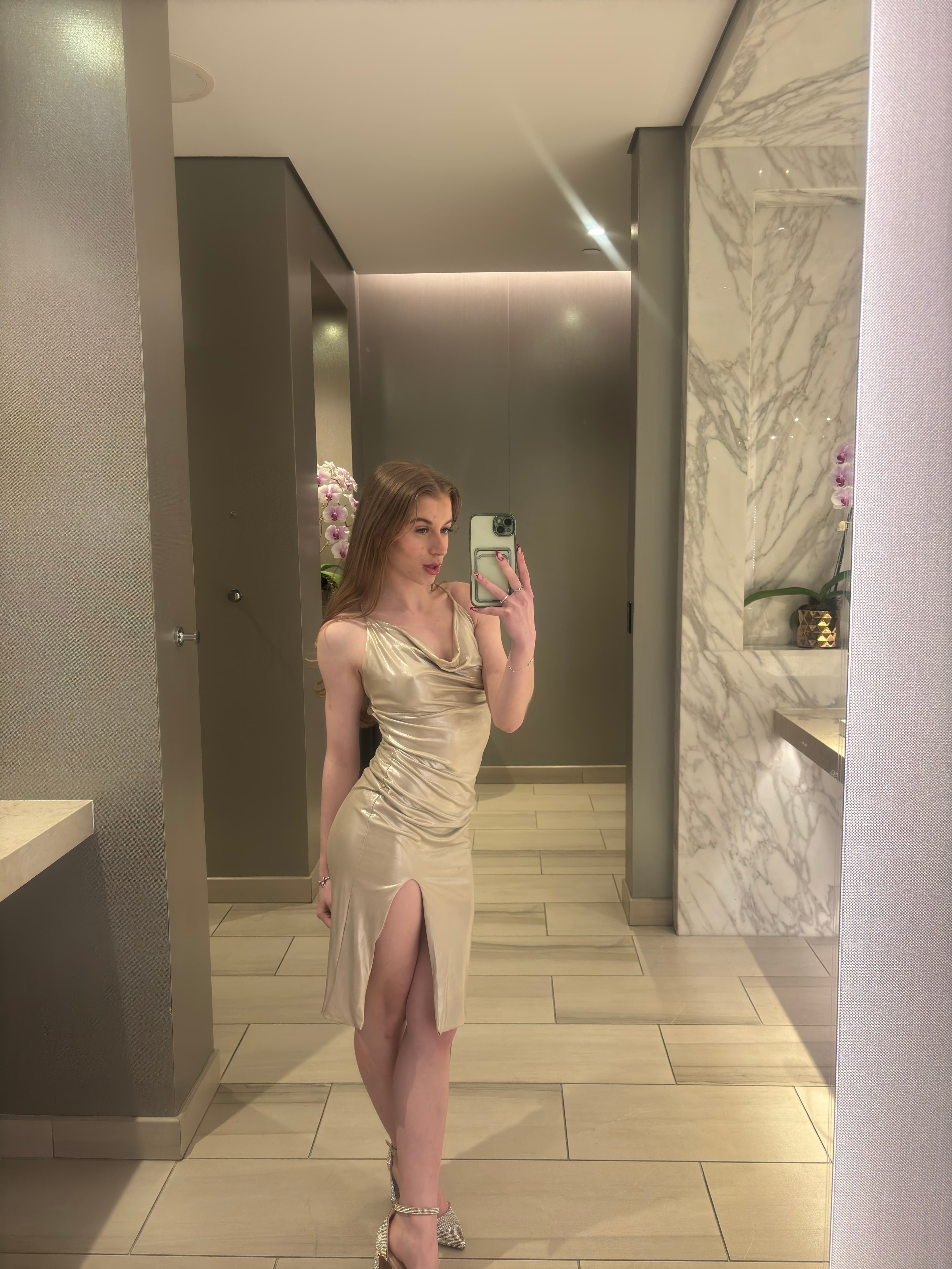 Mia Doll in a champagne satin gown